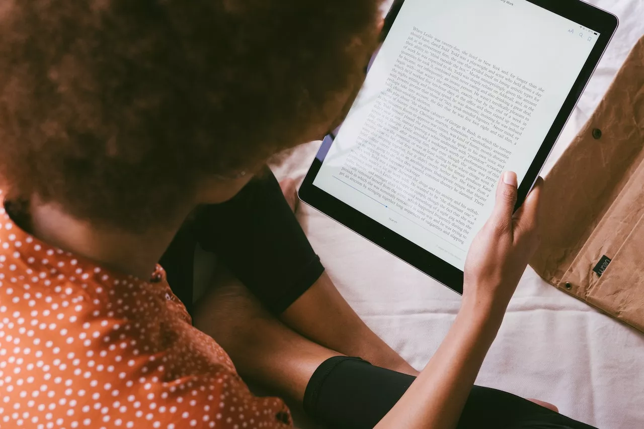 woman reading on ipad